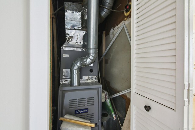 utility room with heating unit