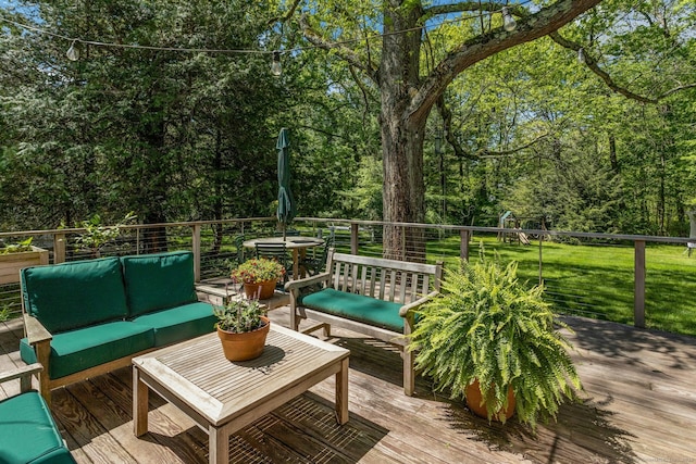 deck with an outdoor hangout area and a lawn