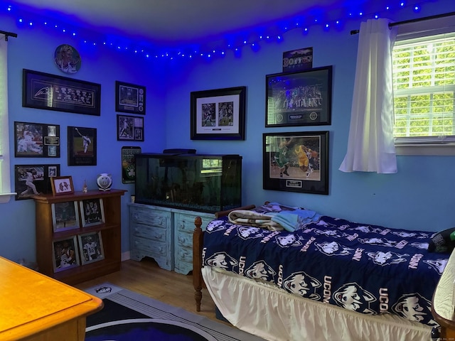 bedroom featuring wood finished floors
