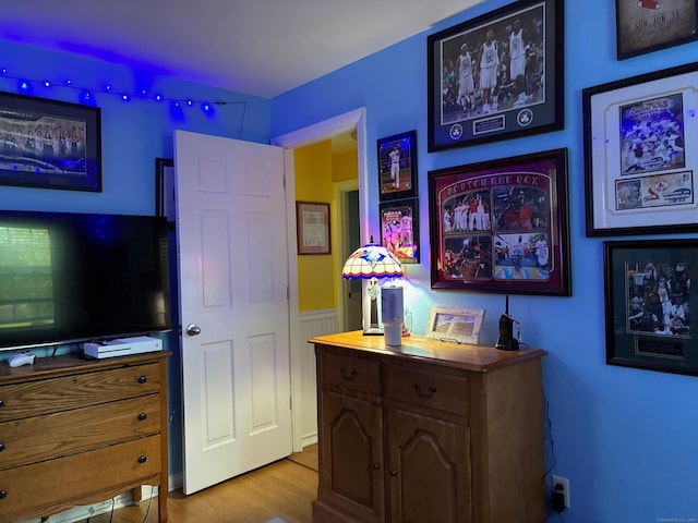 bedroom with wood finished floors