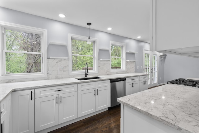kitchen featuring open shelves, dishwasher, dark wood-type flooring, and a sink