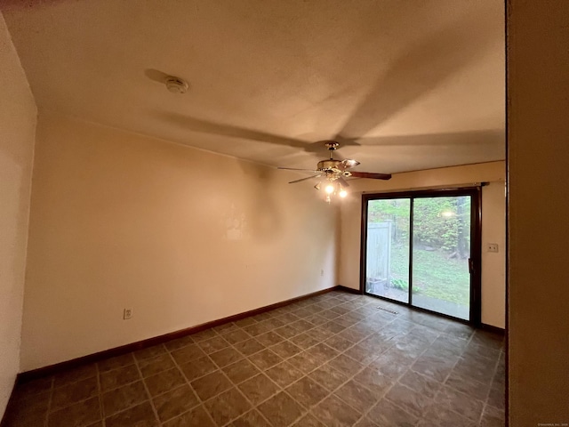 spare room with ceiling fan, baseboards, and visible vents