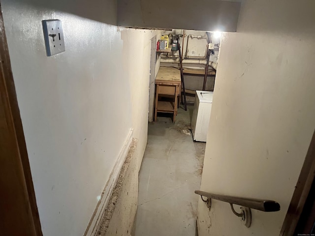 unfinished basement with washer / clothes dryer