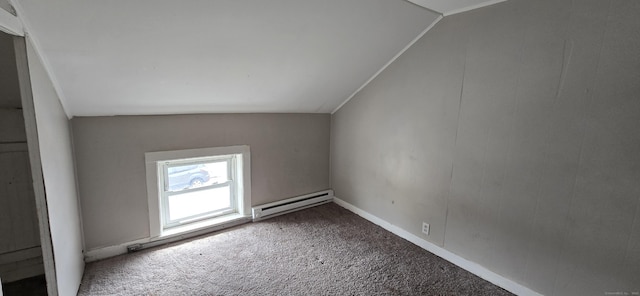 additional living space featuring carpet floors, baseboard heating, and vaulted ceiling