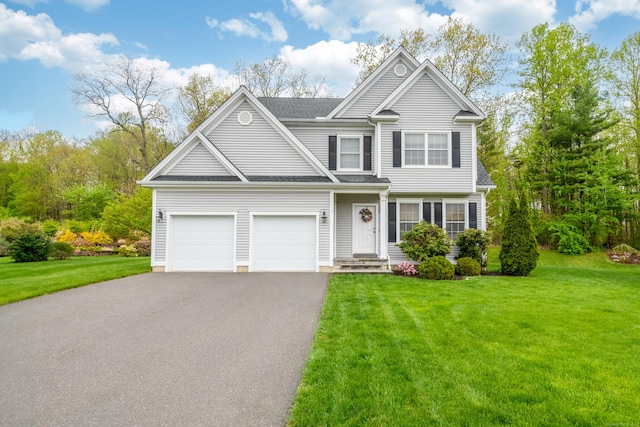 traditional home with aphalt driveway, roof with shingles, and a front yard