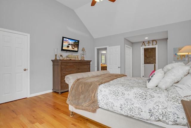 bedroom with baseboards, a ceiling fan, light wood finished floors, and lofted ceiling