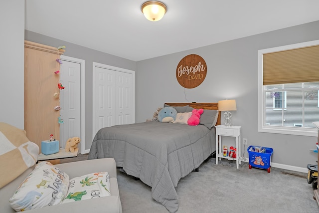 carpeted bedroom with baseboards