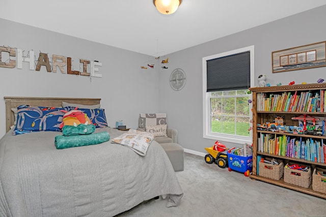 carpeted bedroom with baseboards