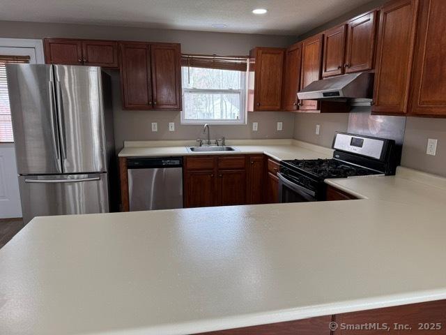 36 Meadowrue Dr Unit 36, Glastonbury, CT 06033 - kitchen featuring light countertops, stainless steel appliances, a sink, and under cabinet range hood