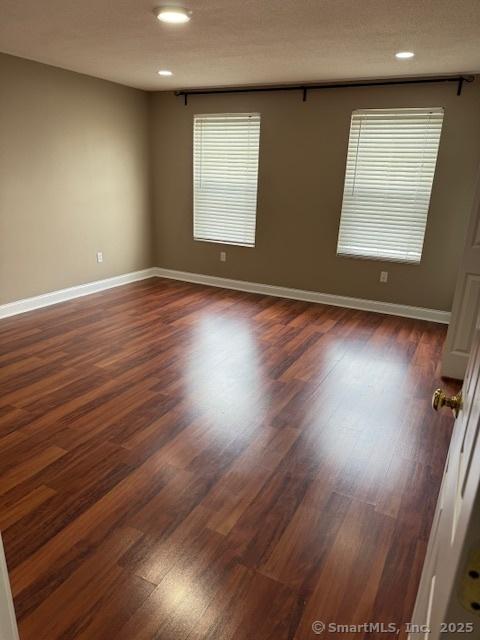 36 Meadowrue Dr Unit 36, Glastonbury, CT 06033 - spare room featuring baseboards, dark wood-style floors, and recessed lighting