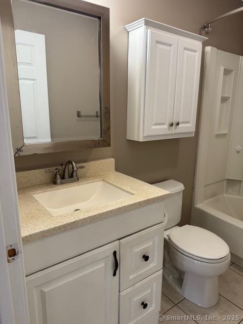 36 Meadowrue Dr Unit 36, Glastonbury, CT 06033 - bathroom featuring toilet, tile patterned flooring, vanity, and shower / washtub combination