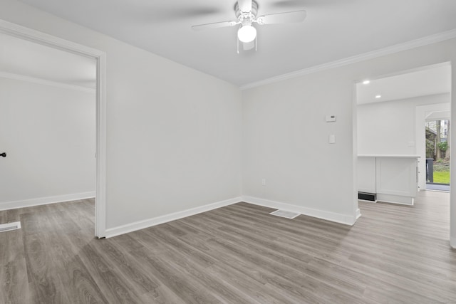 18 Brook St, Shelton, CT 06484 - unfurnished room featuring wood finished floors, visible vents, baseboards, ceiling fan, and ornamental molding