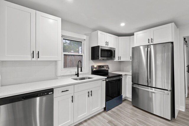 18 Brook St, Shelton, CT 06484 - kitchen with light countertops, white cabinetry, stainless steel appliances, and a sink