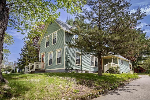 view of property exterior with a chimney