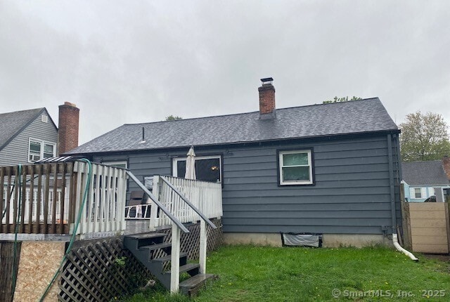 142 Yale St, Hartford, CT 06106 - back of house featuring a deck, a yard, and a chimney
