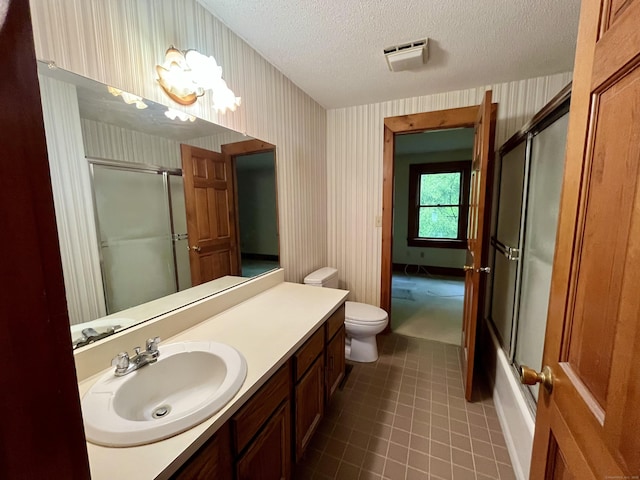 bathroom with vanity, a textured ceiling, tile patterned floors, an inviting chandelier, and wallpapered walls