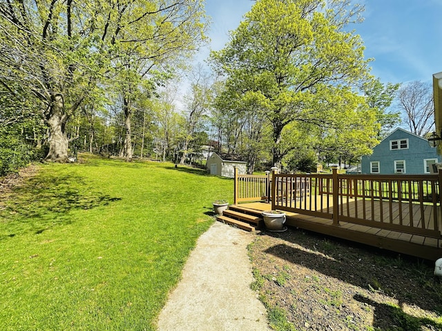 5 N Ridgeland Rd, Wallingford, CT 06492 - view of green lawn featuring a deck, a storage unit, and an outdoor structure