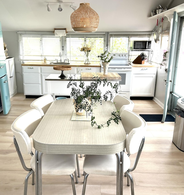 1 4th St, Madison, CT 06443 - dining area with light wood finished floors and healthy amount of natural light