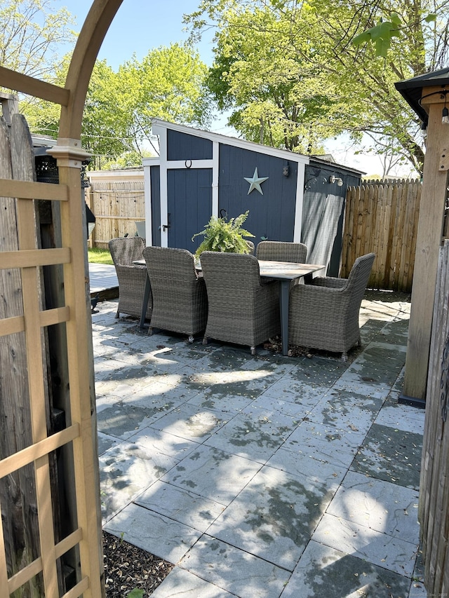 1 4th St, Madison, CT 06443 - fenced backyard featuring a shed, outdoor dining area, and a patio area