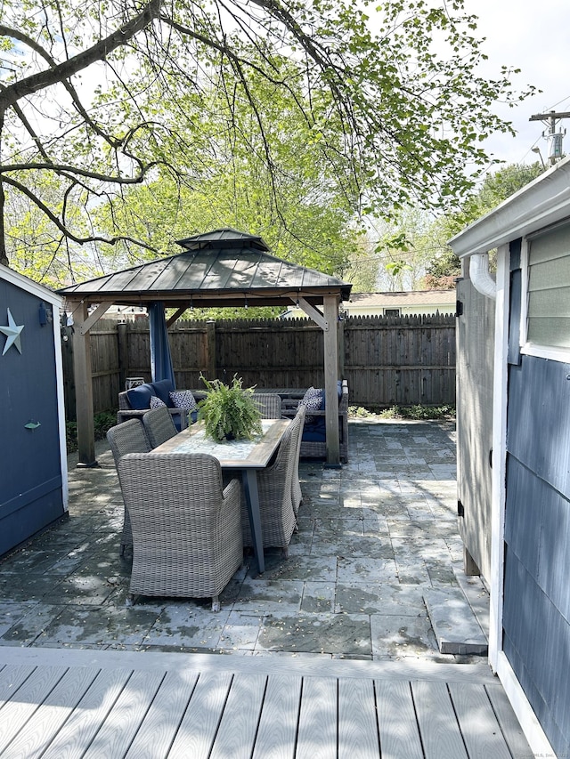 1 4th St, Madison, CT 06443 - wooden terrace featuring a gazebo, a fenced backyard, outdoor dining space, and a patio