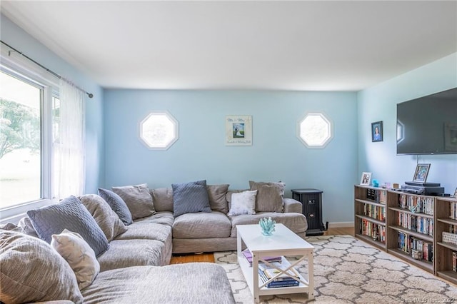 76 Chidsey Dr, North Branford, CT 06471 - living area featuring a healthy amount of sunlight and wood finished floors