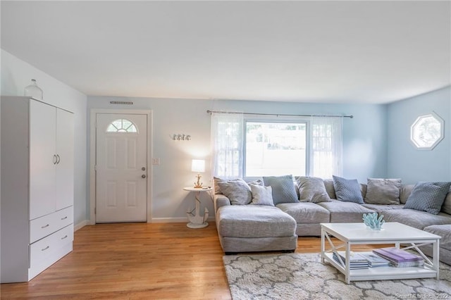 76 Chidsey Dr, North Branford, CT 06471 - living area featuring a wealth of natural light, baseboards, and light wood-type flooring