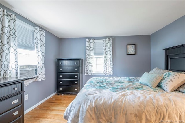 76 Chidsey Dr, North Branford, CT 06471 - bedroom with cooling unit, wood finished floors, and baseboards