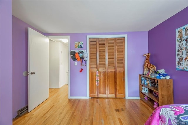 76 Chidsey Dr, North Branford, CT 06471 - bedroom with a closet, light wood-style floors, visible vents, and baseboards
