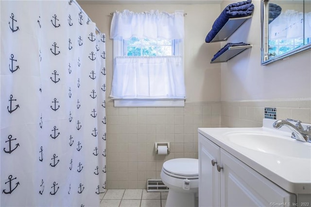 76 Chidsey Dr, North Branford, CT 06471 - bathroom with tile walls, toilet, a shower with curtain, vanity, and tile patterned flooring