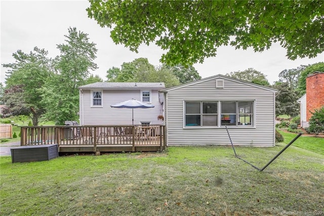 76 Chidsey Dr, North Branford, CT 06471 - back of house with a yard and a wooden deck