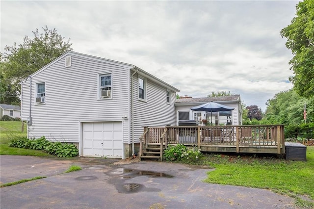 76 Chidsey Dr, North Branford, CT 06471 - back of property with an attached garage, driveway, and a wooden deck