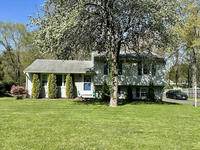 76 Chidsey Dr, North Branford, CT 06471 - split level home with fence and a front yard