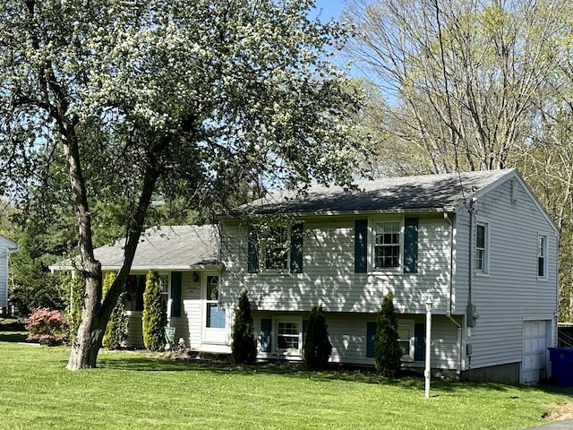 76 Chidsey Dr, North Branford, CT 06471 - split level home featuring roof with shingles and a front lawn