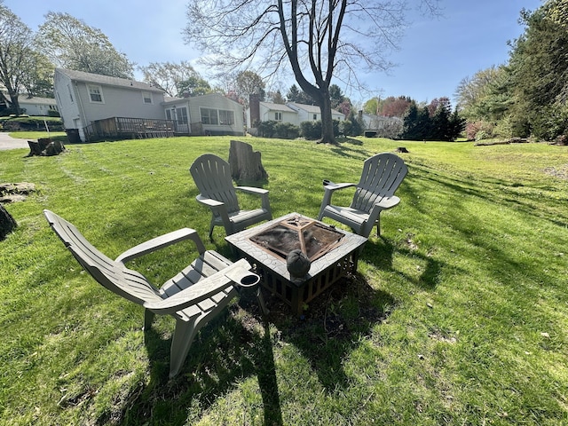 76 Chidsey Dr, North Branford, CT 06471 - view of yard featuring a deck and a fire pit