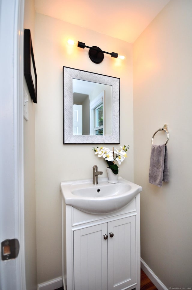 bathroom with baseboards and vanity