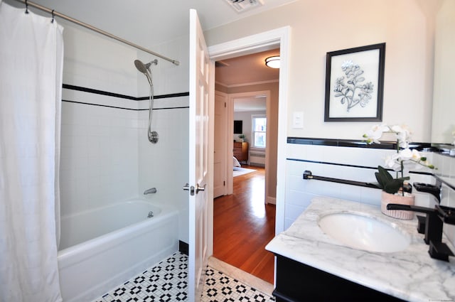 full bathroom with vanity, shower / bathtub combination with curtain, visible vents, and tile patterned floors