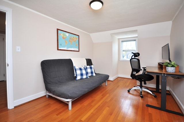 home office with light wood finished floors, crown molding, and baseboards