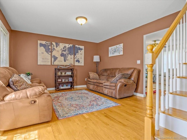 149 Tromley Rd, East Windsor, CT 06088 - living area with stairs, wood finished floors, and baseboards