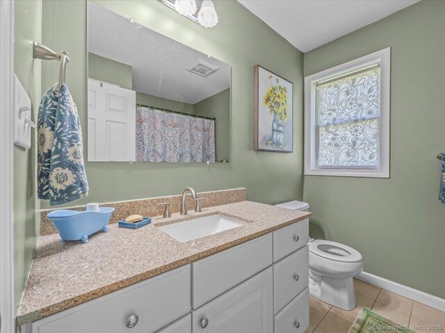149 Tromley Rd, East Windsor, CT 06088 - bathroom featuring toilet, tile patterned floors, vanity, and baseboards