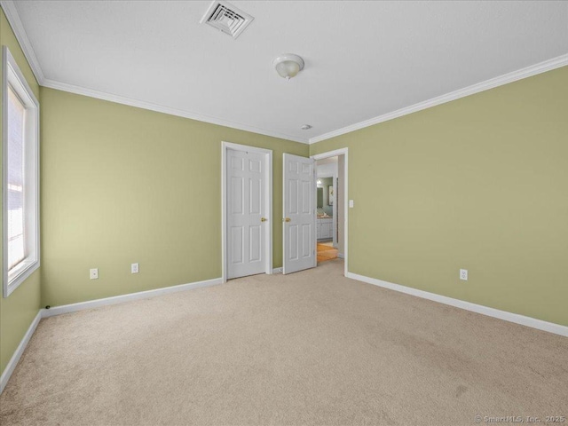 149 Tromley Rd, East Windsor, CT 06088 - unfurnished bedroom with ornamental molding, light carpet, and baseboards
