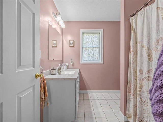 149 Tromley Rd, East Windsor, CT 06088 - bathroom with vanity, tile patterned floors, and baseboards