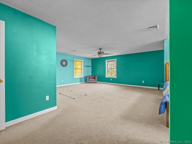 149 Tromley Rd, East Windsor, CT 06088 - unfurnished room featuring a ceiling fan, carpet floors, a textured ceiling, and baseboards