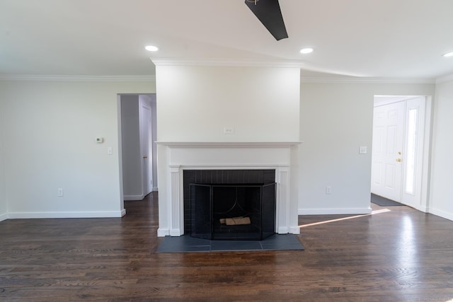 unfurnished living room with wood finished floors, recessed lighting, a fireplace, crown molding, and baseboards