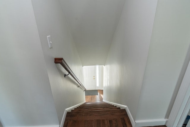 stairs with baseboards and wood finished floors