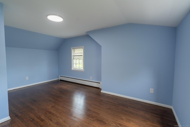 bonus room with vaulted ceiling, wood finished floors, baseboards, and a baseboard heating unit