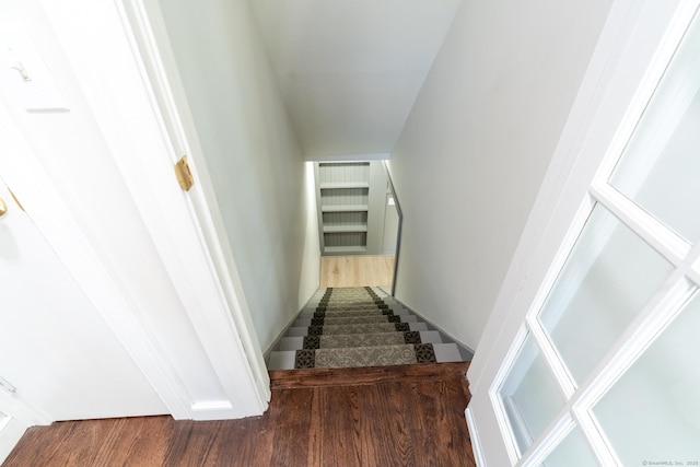 stairway featuring wood finished floors
