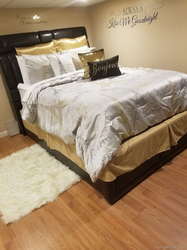 bedroom with wood finished floors