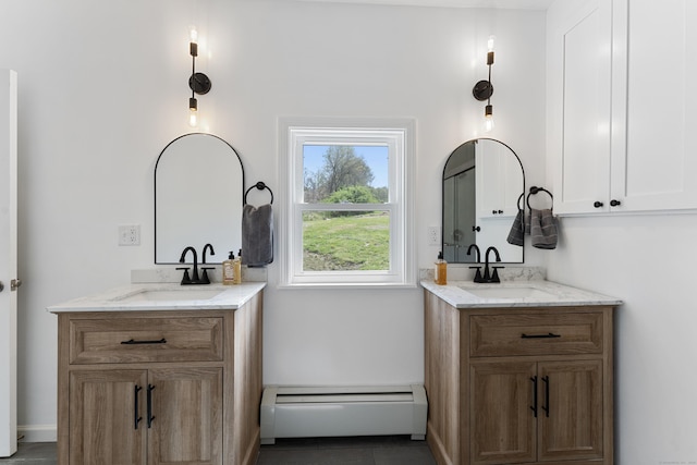 72 Old Canterbury Rd, Hampton, CT 06247 - bathroom featuring a sink, a baseboard radiator, and two vanities