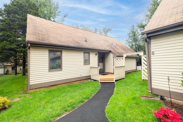 7 Copper Hill Dr Unit 7, Guilford, CT 06437 - view of front of property with roof with shingles, a wooden deck, and a front lawn