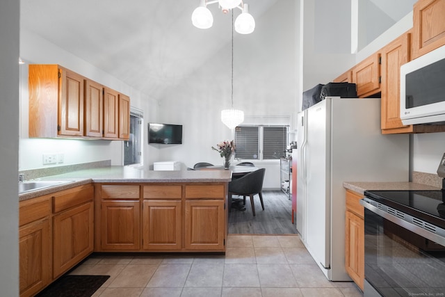 7 Copper Hill Dr Unit 7, Guilford, CT 06437 - kitchen featuring an inviting chandelier, light tile patterned floors, high vaulted ceiling, white microwave, and range with electric stovetop